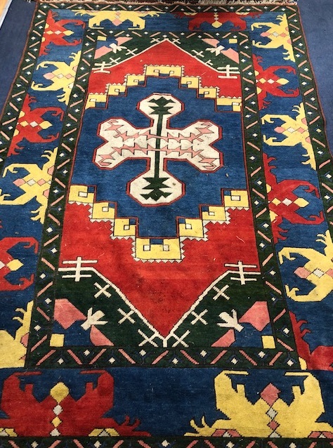 A Turkish blue ground rug 184 x 137cm